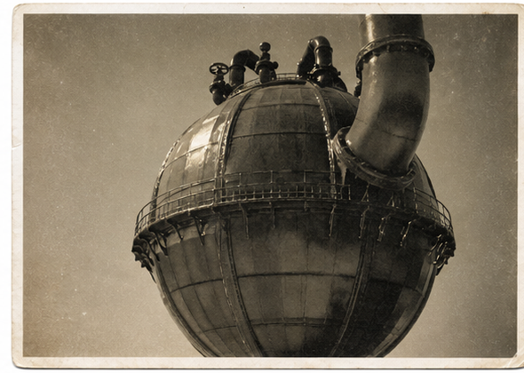 Upper detail view of a Malin desalination sphere showing the domed casing, pipework, and external platform rail.